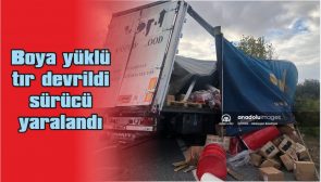 BOYA YÜKLÜ TIR DEVRİLDİ, SÜRÜCÜ YARALANDI