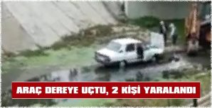 ARAÇ DEREYE UÇTU, 2 KİŞİ YARALANDI